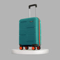 Teal small cabin suitcase with telescopic handle and 8 wheels, angled close-up.