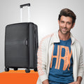 Black polypropylene carry-on suitcase with telescopic handle and spinner wheels