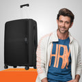 Large black hardshell suitcase with side handle, zipper, textured finish and 4 wheels