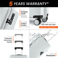 White cabin suitcase detail view with lock, telescopic handle, and four wheels