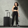 55cm cabin suitcase in dark grey/black standing with top handle and wheels