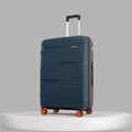 Large upright check-in suitcase, dark blue ribbed shell, orange spinner wheels