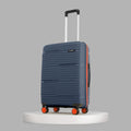 Medium check-in suitcase with 8 wheels, dark blue ribbed shell and telescopic handle