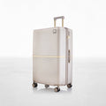 Hard-shell polycarbonate trolley luggage, beige, side view with handle and zipper trim