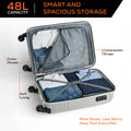 Light gray cabin suitcase open to show organized packing compartments