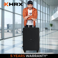 Black hard-shell small suitcase with telescopic handle and four wheels, front view