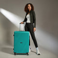 Large polypropylene suitcase in teal with telescopic handle and 4 spinner wheels