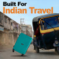 Teal large suitcase on four wheels, side angle with upright telescopic handle.
