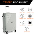 Large polypropylene suitcase, light gray, front view with telescopic handle and four wheels.