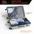 Large polypropylene suitcase, light gray, open with compartments and compression straps.
