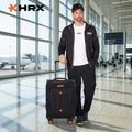 Black soft body spinner trolley with telescopic handle and front pocket, four wheels.