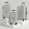 Set of three hard-shell luggage trolleys with telescopic handle and four wheels, light gray
