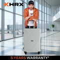 Hard-shell light gray luggage trolley with telescopic handle and four wheels, upright