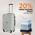 Silver medium rolling suitcase with four wheels and extended telescopic handle.