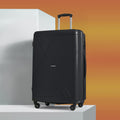 Large black polypropylene suitcase with textured shell and telescopic handle