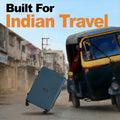 Teal large suitcase with telescopic handle and four wheels, angled view