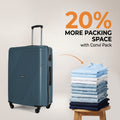 Teal large suitcase with telescopic handle and four wheels beside folded clothes