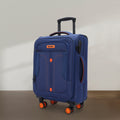 Blue soft body spinner trolley luggage in side view with orange wheels and accents