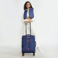 Blue soft body spinner trolley with telescopic handle and front storage pocket, four wheels.