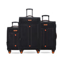 Black soft-sided spinner trolley suitcase set with nested sizes and orange wheels