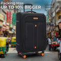 Black soft-sided spinner trolley suitcase with front pocket and orange wheels