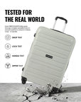 Large light-gray trolley suitcase with textured shell and four wheels