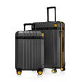 Set of 2 black polycarbonate trolley suitcases with yellow wheel accents and top handles