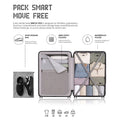 Open dark grey polycarbonate trolley suitcase interior with straps and neatly packed items