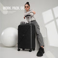 Black cabin spinner suitcase with telescopic handle and four low-profile wheels