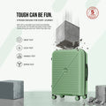 Medium green spinner suitcase front view with test-style rubble at the base.