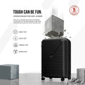 Black hard-shell suitcase with telescopic handle, front face detailing, and spinner wheels