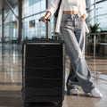 Black large check-in trolley pulled along with retractable handle and eight-wheel base