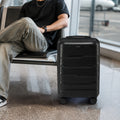 Black cabin trolley suitcase with telescopic handle and eight spinner wheels on floor