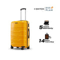 Yellow medium trolley suitcase with telescopic handle and eight wheels, warranty badge