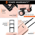 Peach cabin suitcase corner with easy-access lock and 8 spinner wheels.