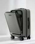 Dark gray polycarbonate laptop trolley with side divider open, four spinner wheels