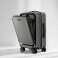 Dark gray polycarbonate laptop trolley with side divider open, four spinner wheels