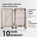Beige hard-shell trolley suitcase open, showing detachable toiletry hanger and dual compartments