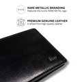 Black leather bi-fold wallet close-up with metal logo and smooth grain