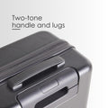 Hard-shell trolley suitcase corner detail with two-tone handle and zip track, dark grey