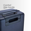 Dark blue trolley comfort grip handle with recessed latch on hard-shell suitcase