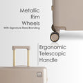 Beige hard-shell trolley suitcase corner view showing metallic rim wheels and handle