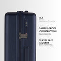 Dark blue hard-shell suitcase showing TSA lock panel and reinforced side detail