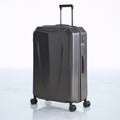 Hard shell polycarbonate trolley luggage in dark grey with front corner and side zipper pocket