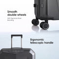 Dark gray trolley suitcase showing smooth double spinner wheels and telescopic handle