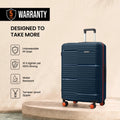Medium check-in suitcase, dark blue ribbed shell with orange wheel accents