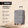 Grey polypropylene check-in suitcase with extendable trolley handle and orange wheels