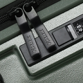 Dark green hard-shell suitcase zipper track with combination lock and pull tabs