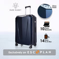 Dark blue hard-shell trolley suitcase with upright telescopic handle and corner wheels