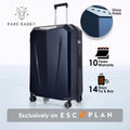 Dark blue hard-shell trolley suitcase upright with telescopic handle and corner wheels